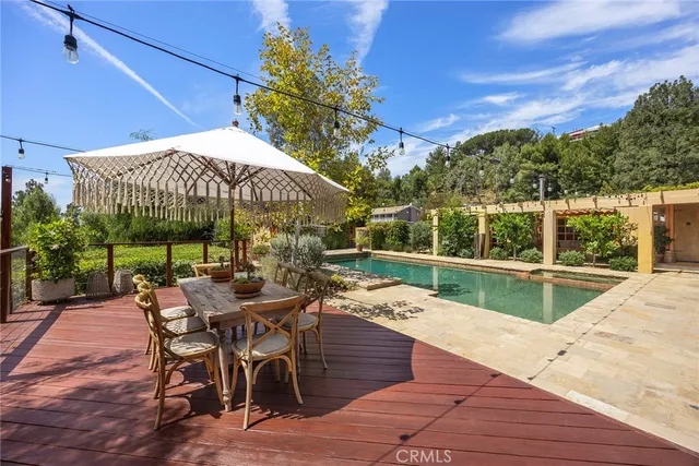 an aerial view of a house with a yard and lake view