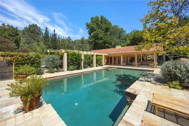 a view of a lake with a house in the background