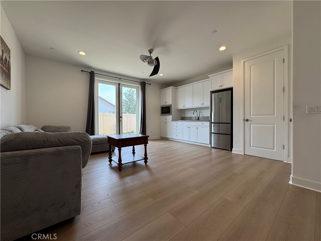 13562 Pointer Court Riverside, CA 92503 - Photo 14 of 42 a living room with furniture and a kitchen