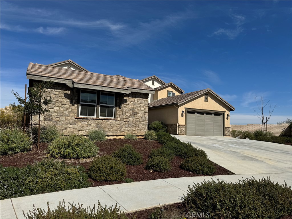 13562 Pointer Court Riverside, CA 92503 - Photo 2 of 42 a front view of a house with a yard