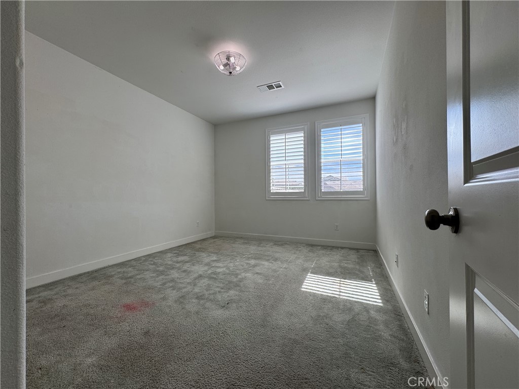 13562 Pointer Court Riverside, CA 92503 - Photo 21 of 42 a view of an empty room with a window