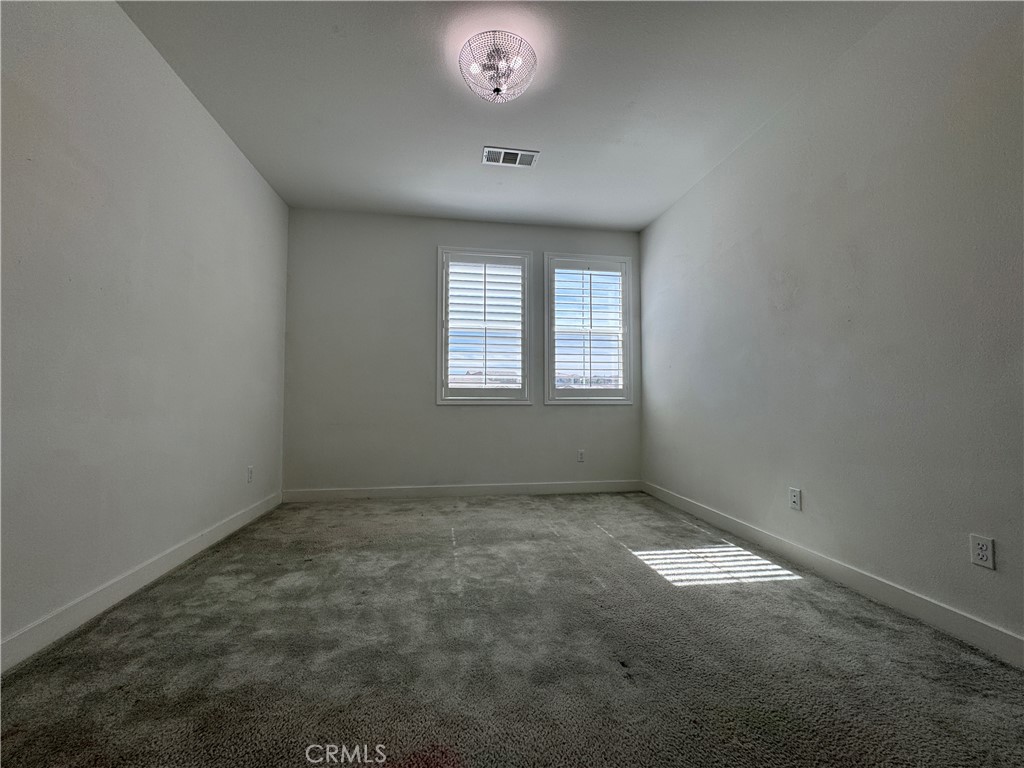 13562 Pointer Court Riverside, CA 92503 - Photo 22 of 42 an empty room with a window