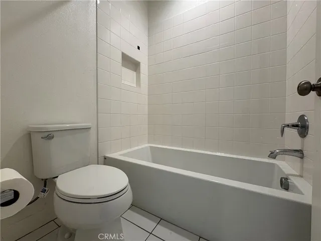 a bathroom with a sink a toilet and a bathtub