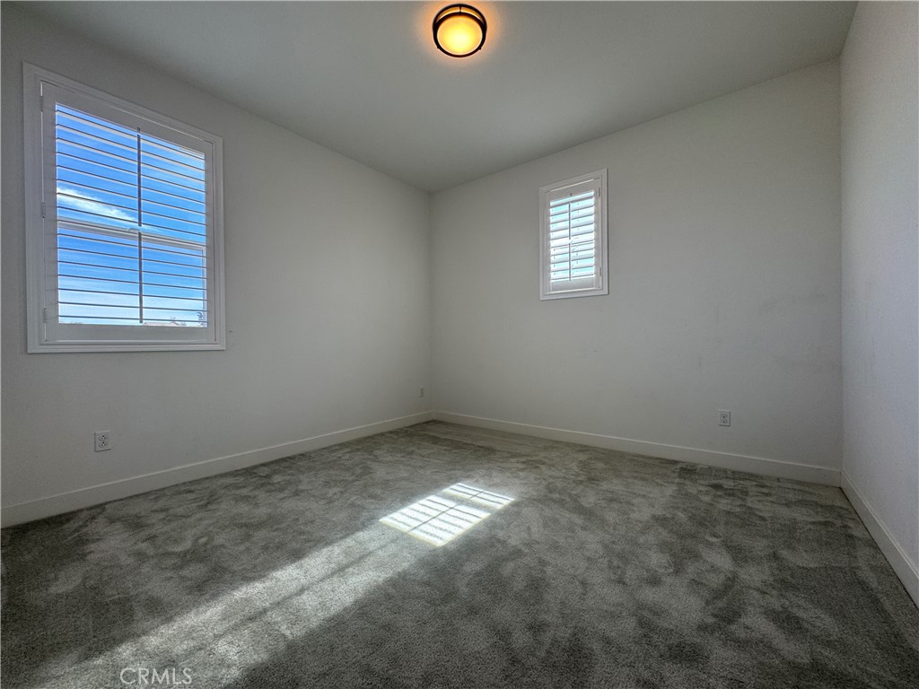 13562 Pointer Court Riverside, CA 92503 - Photo 32 of 42 an empty room with windows