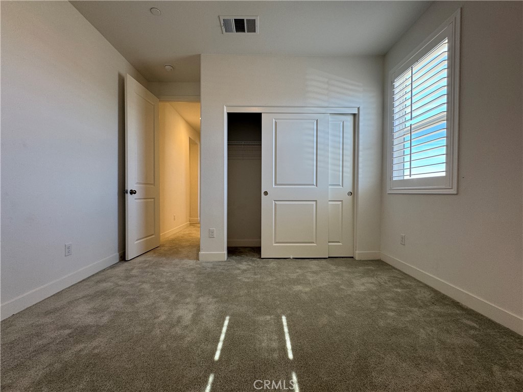13562 Pointer Court Riverside, CA 92503 - Photo 33 of 42 an empty room with windows