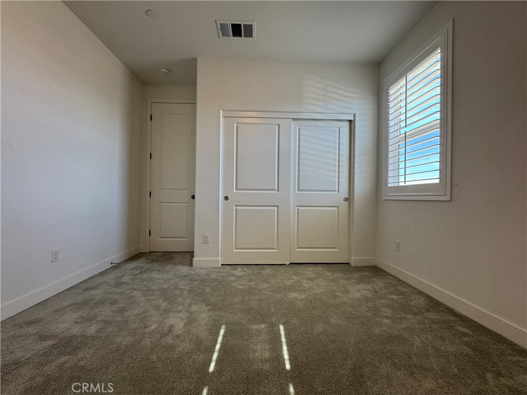13562 Pointer Court Riverside, CA 92503 - Photo 35 of 42 an empty room with windows