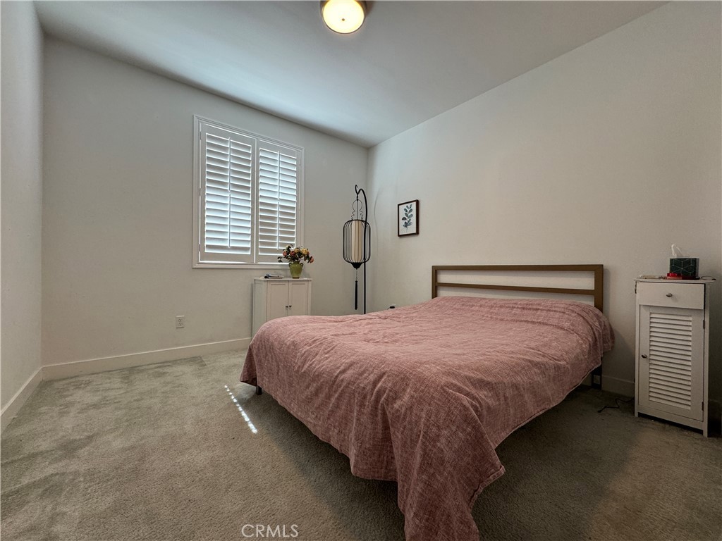13562 Pointer Court Riverside, CA 92503 - Photo 36 of 42 a bedroom with a bed and window