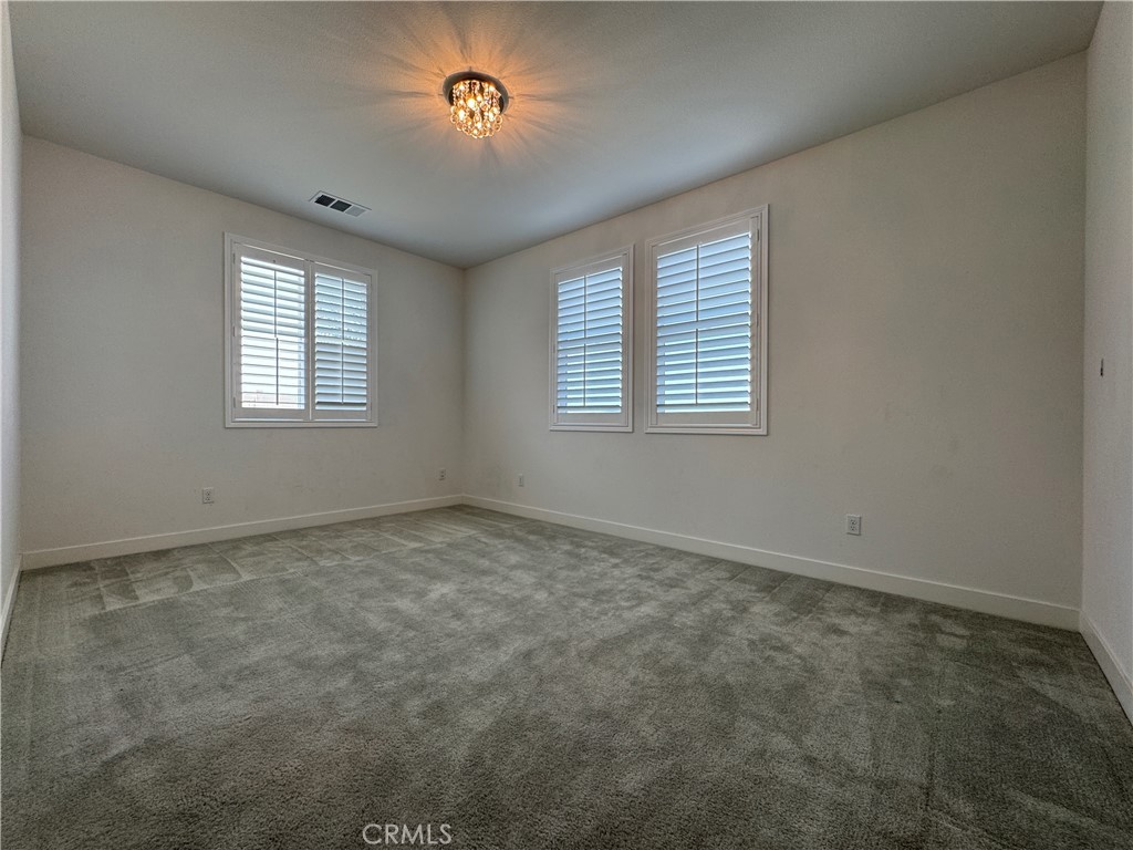 13562 Pointer Court Riverside, CA 92503 - Photo 40 of 42 an empty room with a empty space and windows