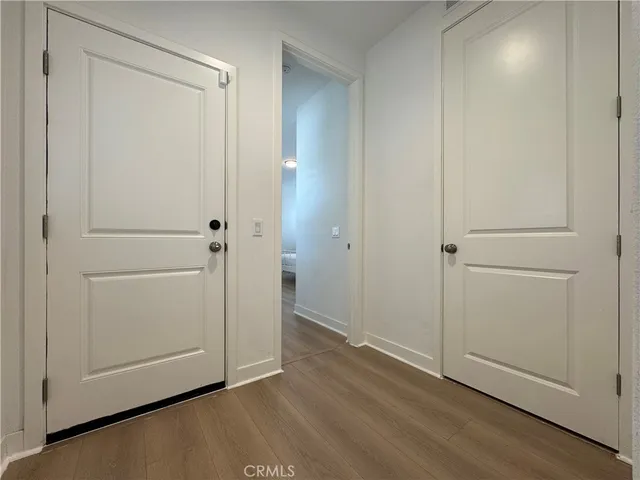 an empty room with wooden floor