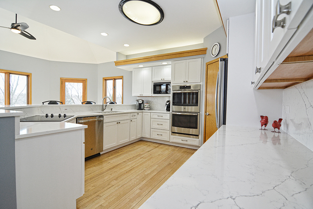 36W455 Lancaster Road St. Charles, IL 60175 - Photo 8 of 34 a large kitchen with cabinets a sink and appliances