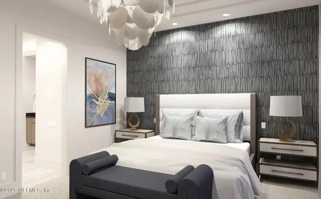 a bedroom with a bed and a chandelier