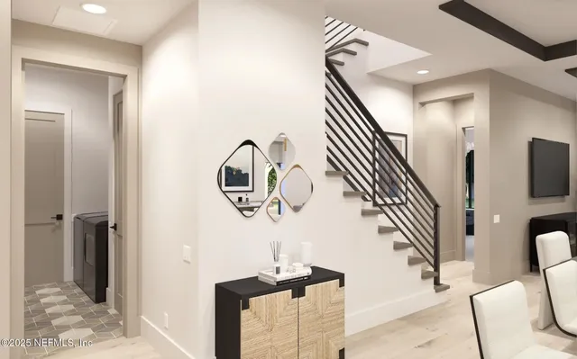 a view of entryway and hall with wooden floor