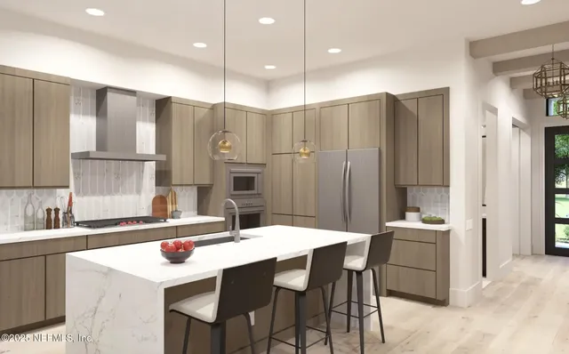 a kitchen with a sink and chairs