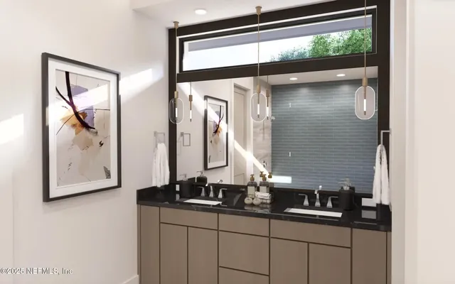 a bathroom with a sink and mirror