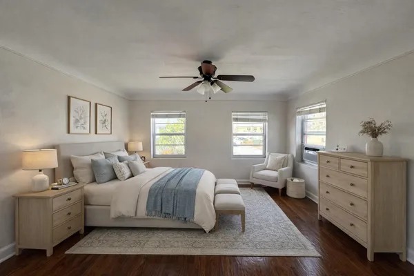 a bedroom with a bed and window