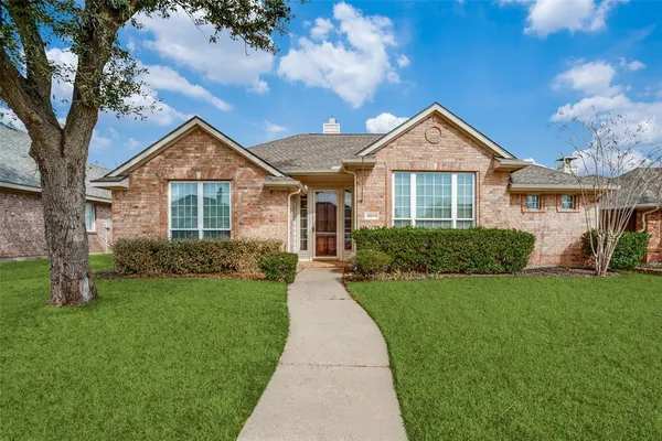 a front view of a house with yard