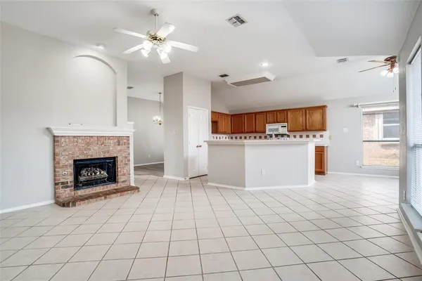a view of a kitchen with furniture and a fireplace