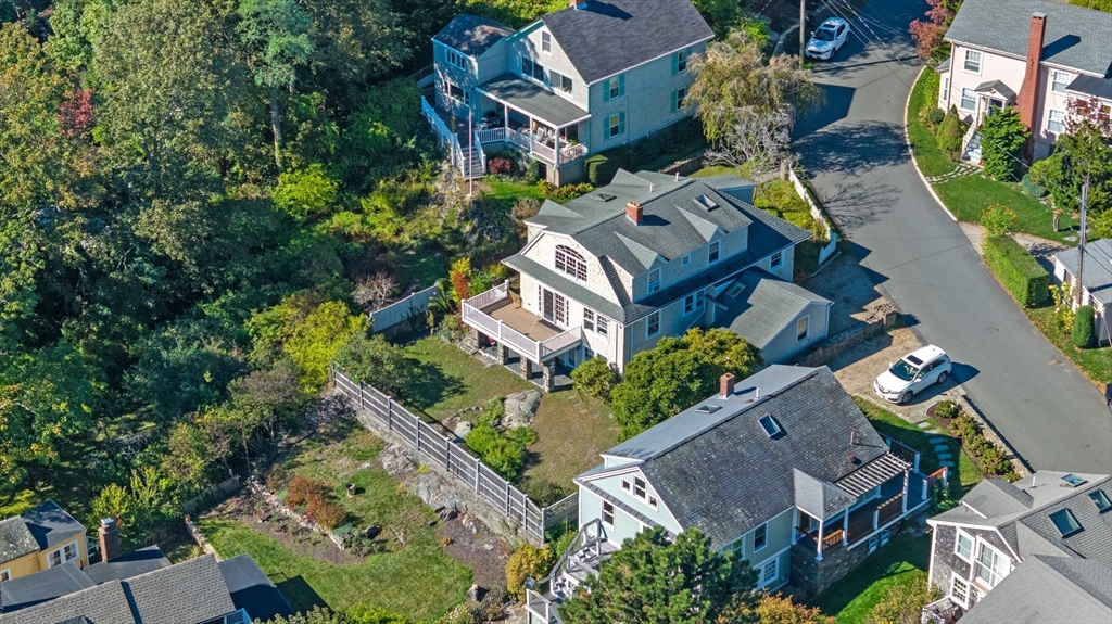 an aerial view of multiple houses with yard