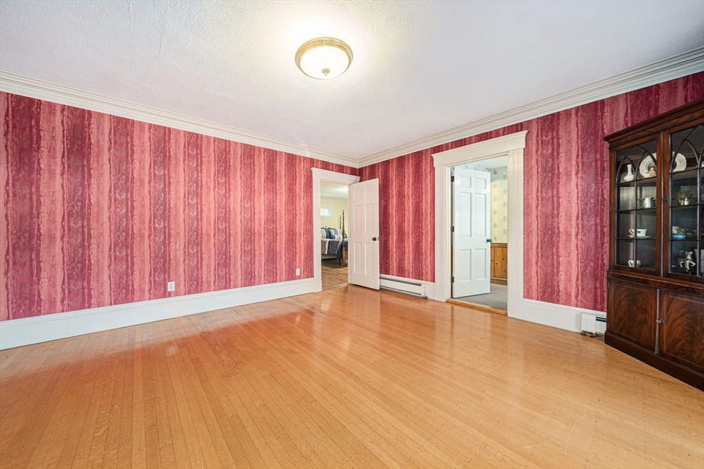1032 Washington Street Canton, MA 02021 - Photo 11 of 42 a view of an empty room with wooden floor and a window