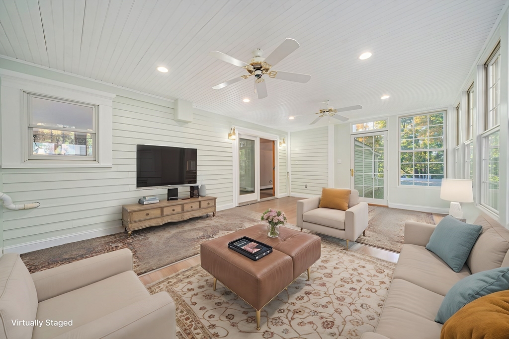 1032 Washington Street Canton, MA 02021 - Photo 12 of 42 a living room with furniture and a flat screen tv