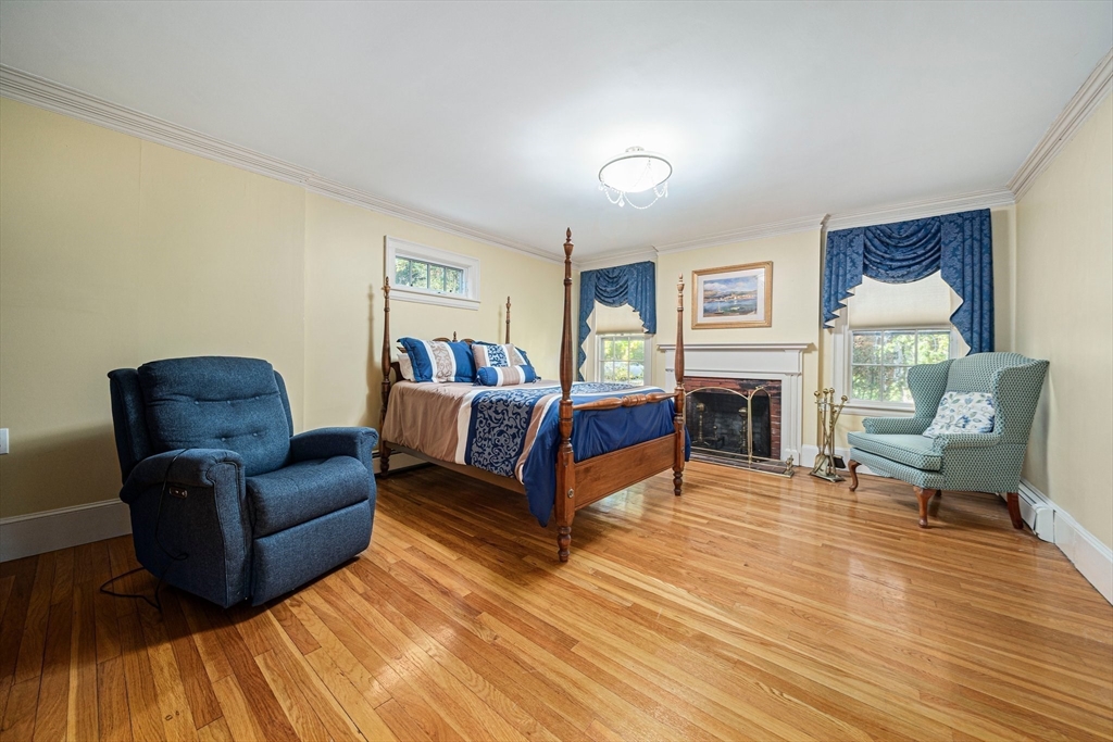 1032 Washington Street Canton, MA 02021 - Photo 14 of 42 a living room with furniture and a fireplace