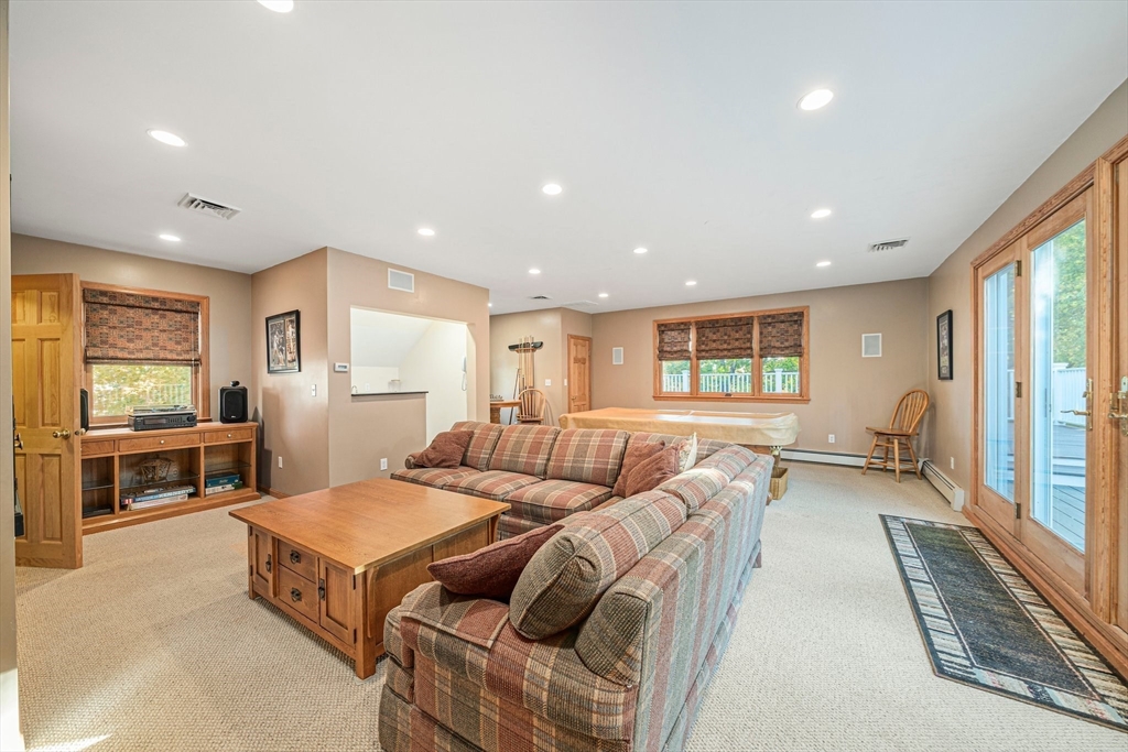 1032 Washington Street Canton, MA 02021 - Photo 19 of 42 a living room with furniture and a table