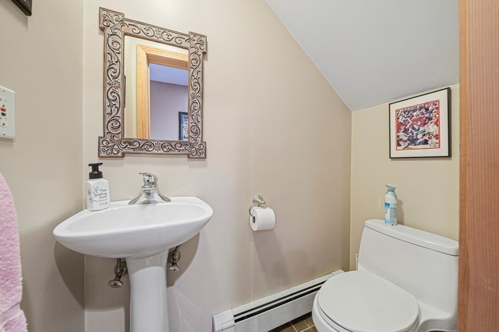 1032 Washington Street Canton, MA 02021 - Photo 22 of 42 a bathroom with a toilet sink and mirror