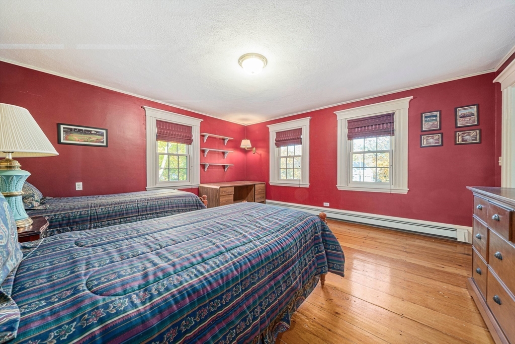 1032 Washington Street Canton, MA 02021 - Photo 26 of 42 a bedroom with a bed and a window