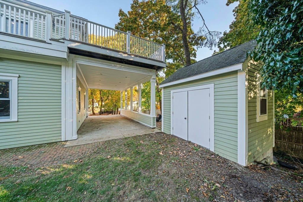 1032 Washington Street Canton, MA 02021 - Photo 40 of 42 a view of a house with a garage and balcony