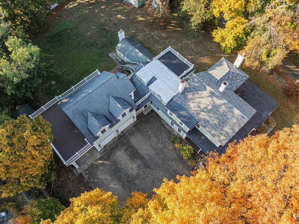 1032 Washington Street Canton, MA 02021 - Photo 41 of 42 an aerial view of a house with a yard and trees