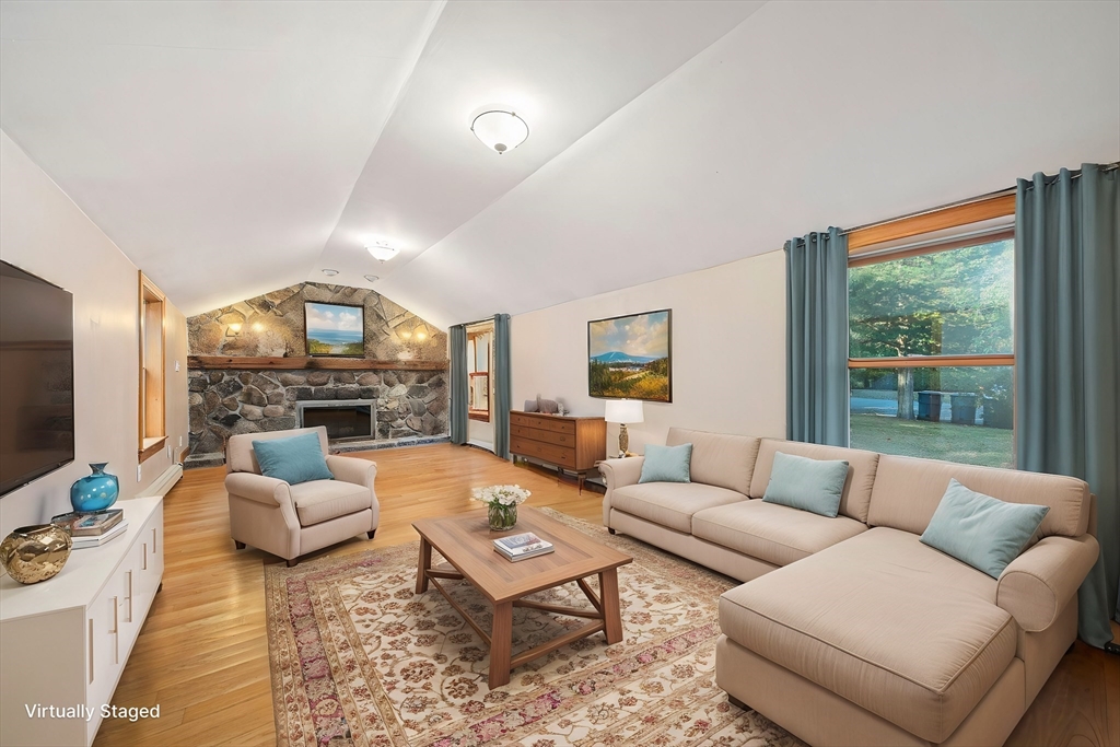 1032 Washington Street Canton, MA 02021 - Photo 7 of 42 a living room with furniture flat screen tv and a large window