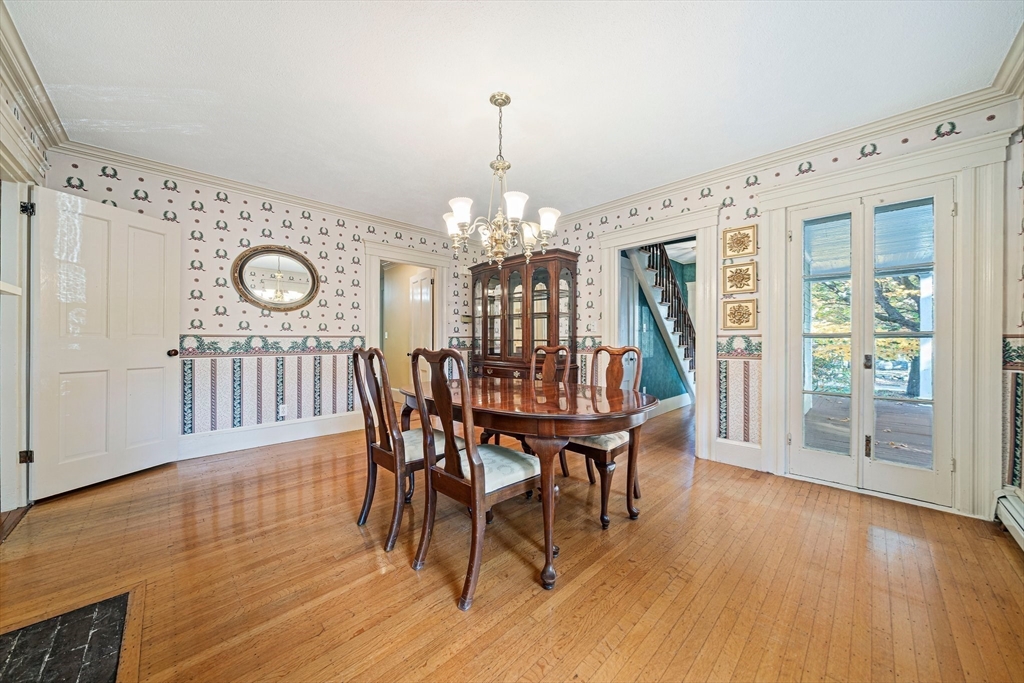 1032 Washington Street Canton, MA 02021 - Photo 9 of 42 a view of a dining room with furniture window and wooden floor