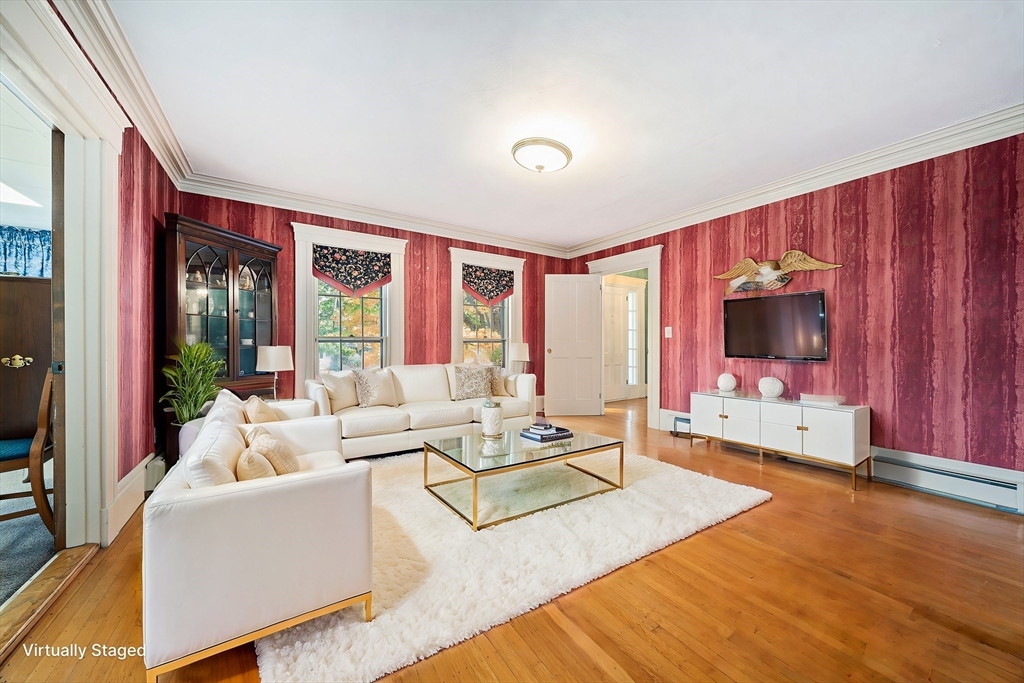1032 Washington Street Canton, MA 02021 - Photo 10 of 42 a living room with furniture large window and flat screen tv