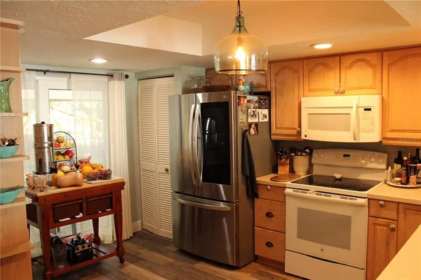 a living room with furniture and a lamp