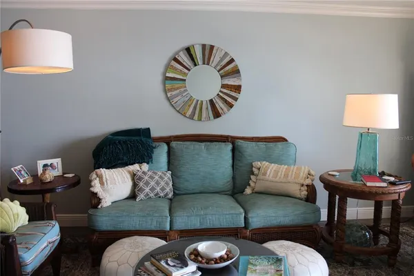 a bedroom with a bed and painting on the wall