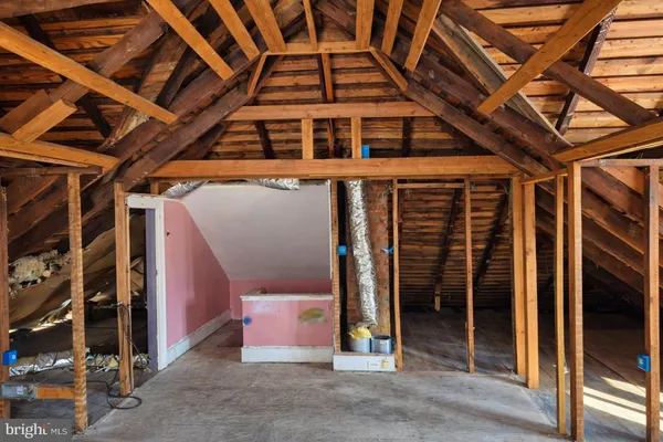 a view of a room with wooden walls