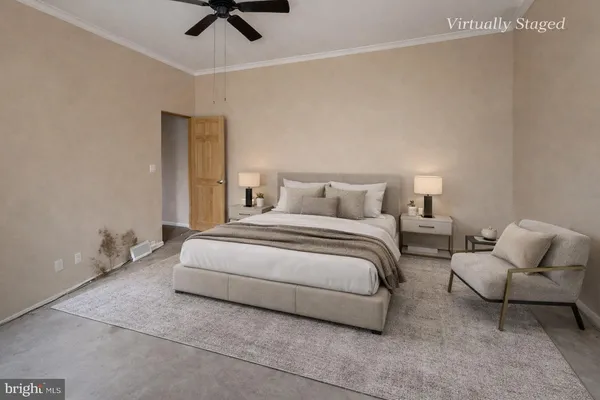 a bedroom with bed and chair