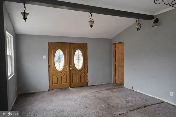 a view of a storage & utility room with windows