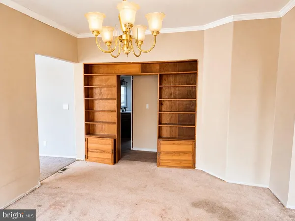 a view of an empty room with a bathroom
