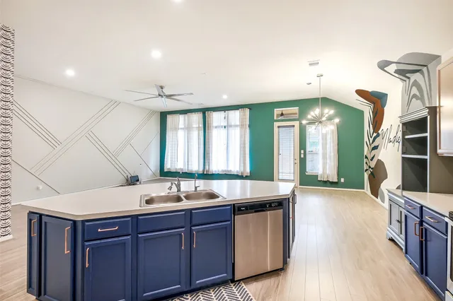 a bathroom with a sink double vanity granite and a large mirror