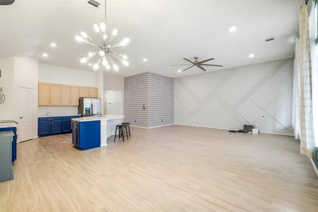 a view of a kitchen with a sink and a window