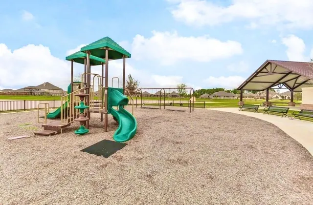 a view of a park with furniture