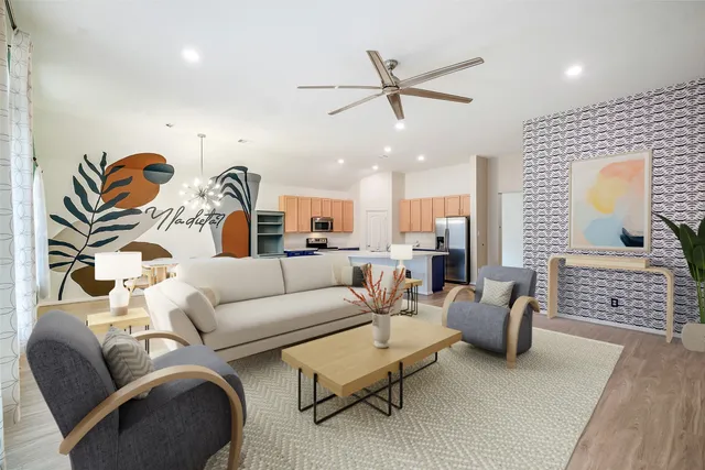 a living room with furniture and a chandelier