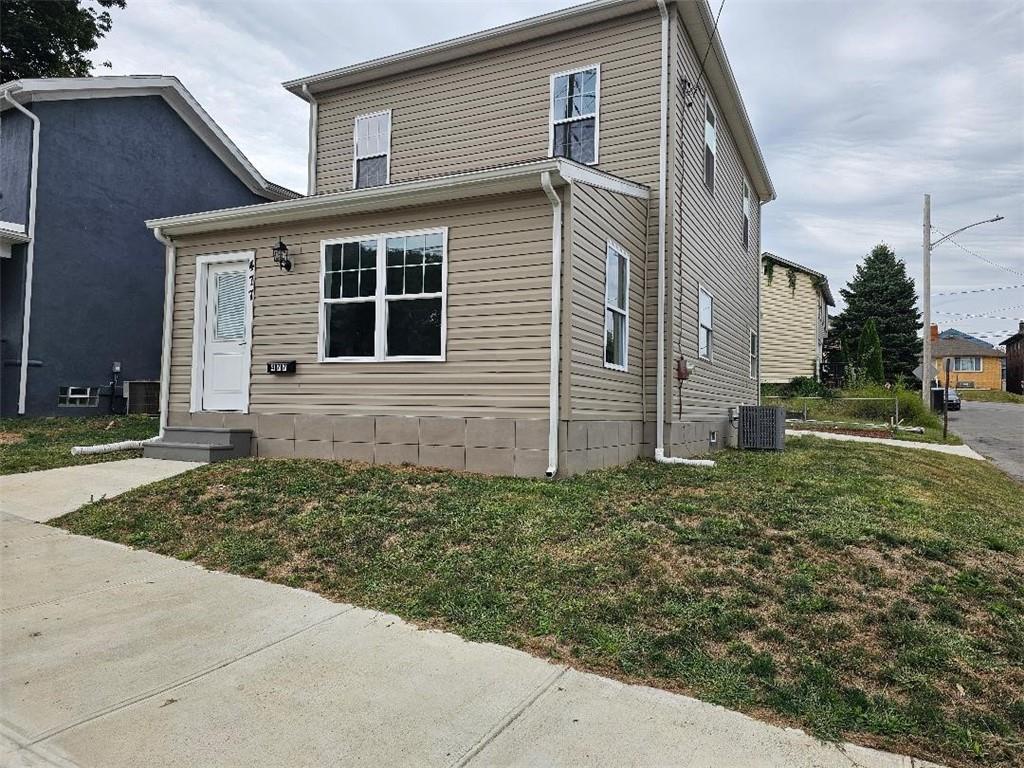 front view of a house with a yard