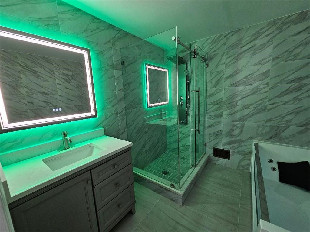 477 Connecticut Avenue Rochester, PA 15074 - Photo 13 of 17 a bathroom with a sink a mirror and shower