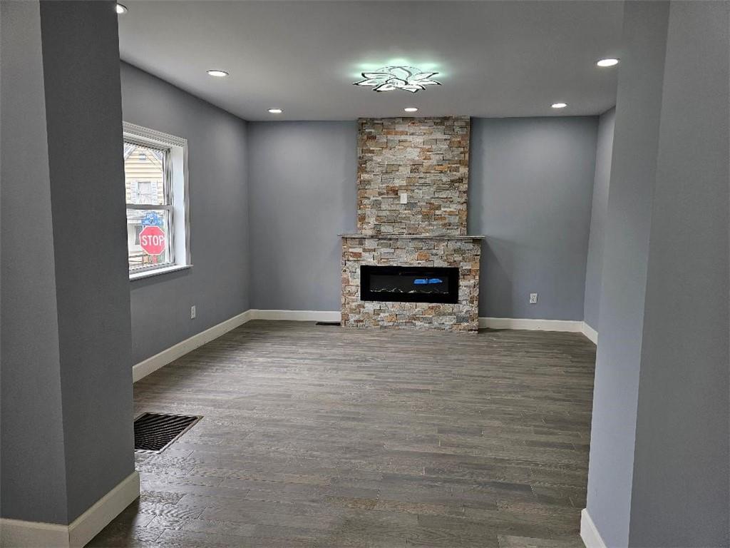 477 Connecticut Avenue Rochester, PA 15074 - Photo 9 of 17 wooden floor in an empty room with a fireplace