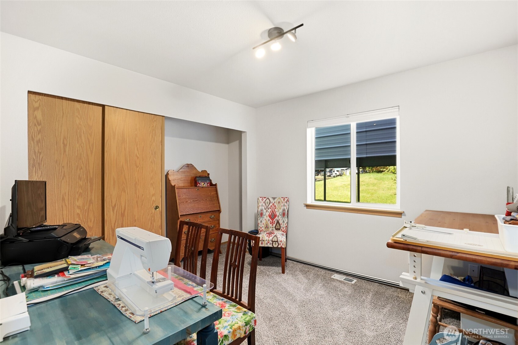 8008 188th Avenue Southwest Rochester, WA 98579 - Photo 24 of 40 a living room with furniture and a window