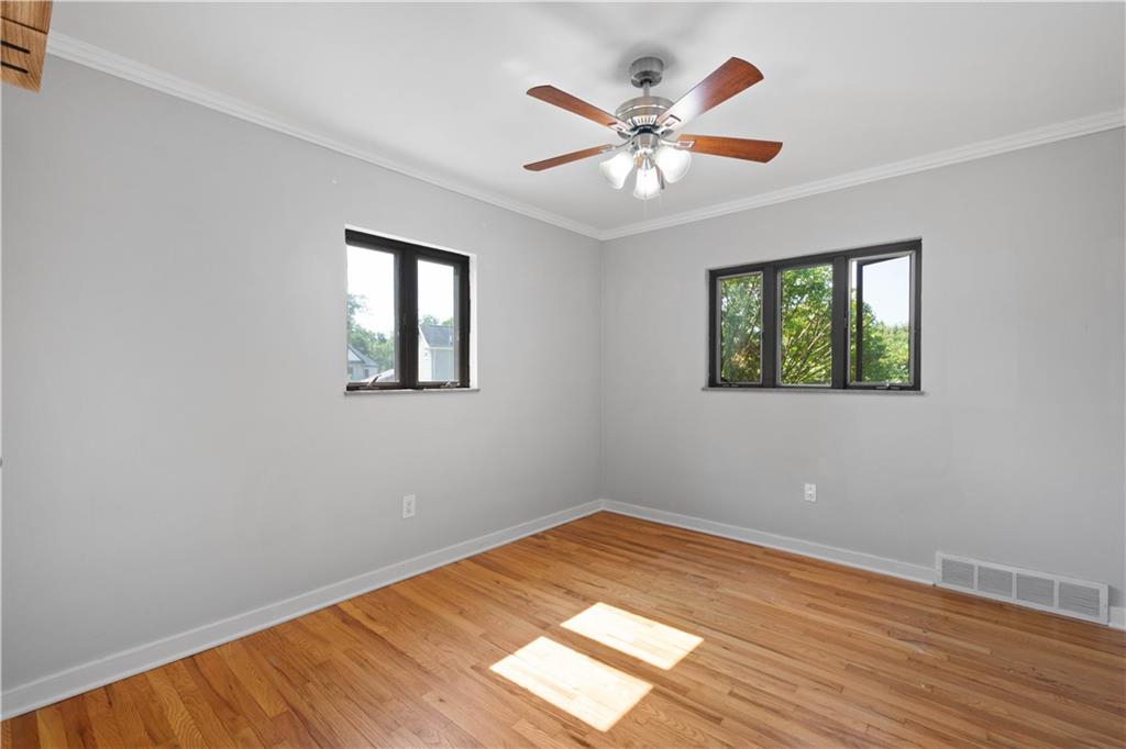 215 Pinchtown Road Pittsburgh, PA 15236 - Photo 11 of 31 a view of empty room with wooden floor and fan