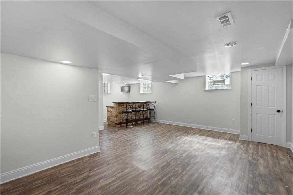 215 Pinchtown Road Pittsburgh, PA 15236 - Photo 16 of 31 an empty room with wooden floor and ceiling fan