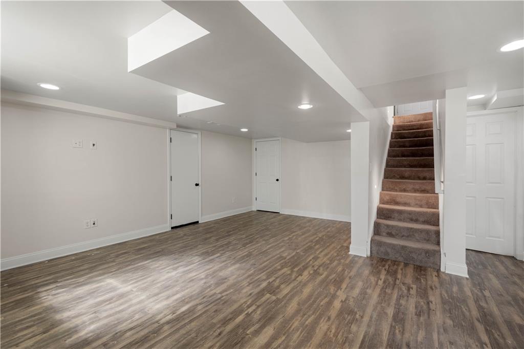 215 Pinchtown Road Pittsburgh, PA 15236 - Photo 18 of 31 an empty room with wooden floor